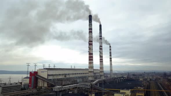 Aerial View of High Chimney Pipes with Grey Smoke From Coal Power Plant