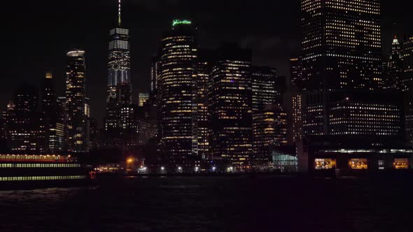 Manhattan Urban Skyline at Night and Ship. New York City. View From the Water