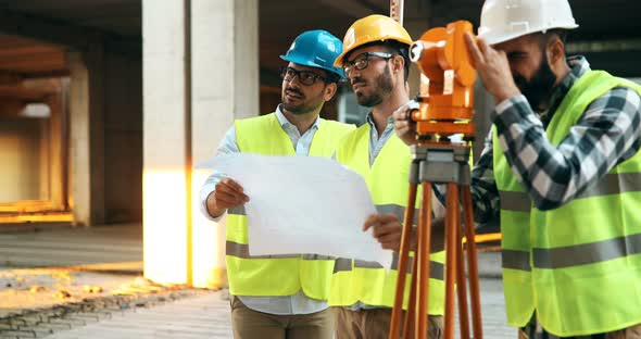 Portrait of Construction Engineers Working on Building Site