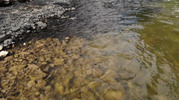 Mountain Shallow River with Clear Water and Stones