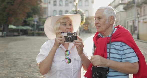 Senior Male and Female Tourists Makes a Photo While Traveling in Lviv