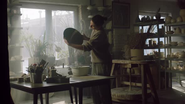 Woman Ceramist Is Glazing Big Plate