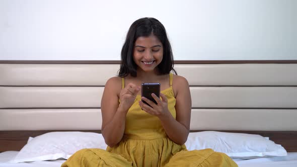 Happy Indian girl shopping online