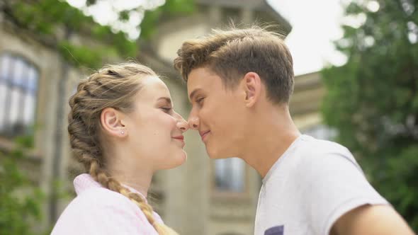 Loving Teen Couple Nuzzling, First Love, Couple Looking at Each Other, Emotions