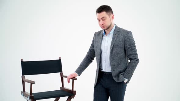 Portrait of a young businessman in light studio. 