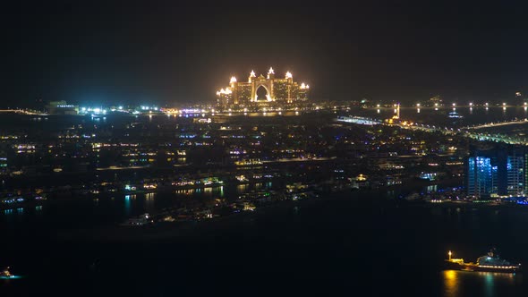 Jumeirah Night Beach Aerial Panorama Dubai Time Lapse. Pan Up