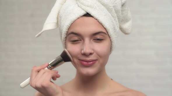 Girl Apllying Powder with Brush