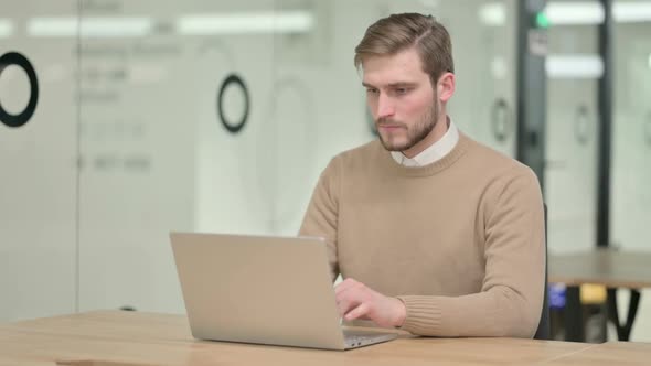 Creative Young Man Closing Laptop Going Away