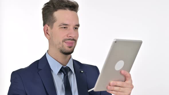 Young Businessman Doing Video Chat on Tablet, White Background