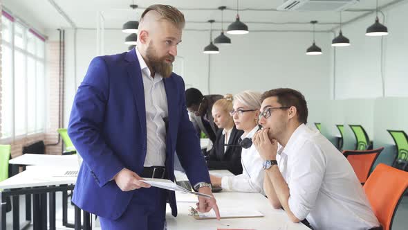 Male Director Give Directions To Employees Office