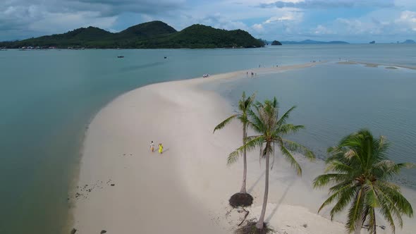 Couple Men and Women Walking on the Beach at the Island Koh Yao Yai Thailand Beach with White Sand