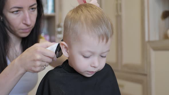 Mom Is Cutting Her Little Son Hair at Home