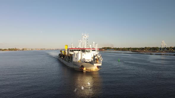 Ship leaving river