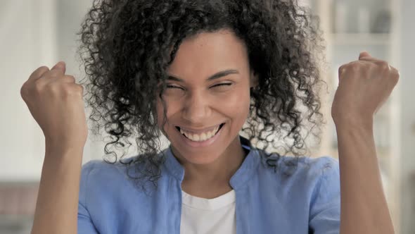 Portrait of African Woman Celebrating Success