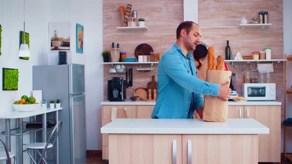 Husband Arriving with Groceries