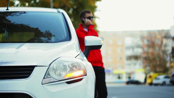  Man Uses the Phone After the Car Machine Has Broken Down