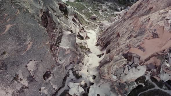 Ancient Turkish Town in Rocky Valley with Volcanic Formations and Cone Rocks Filmed By Drone