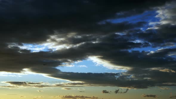 Dark Clouds In Sunset Light