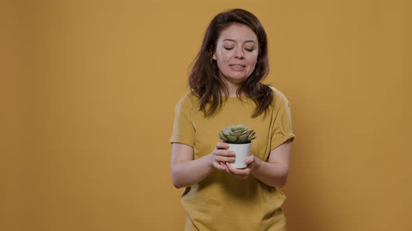 Portrait of Woman Talking About Gardening Hobby and How to Take Care of Succulent House Plant