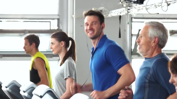 People Running on Treadmill at Gym.