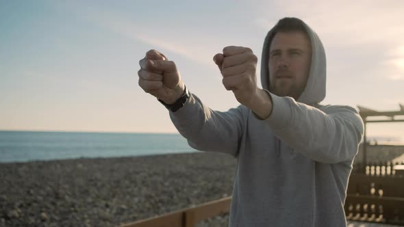 Man Doing Wrist Stretch Exercise