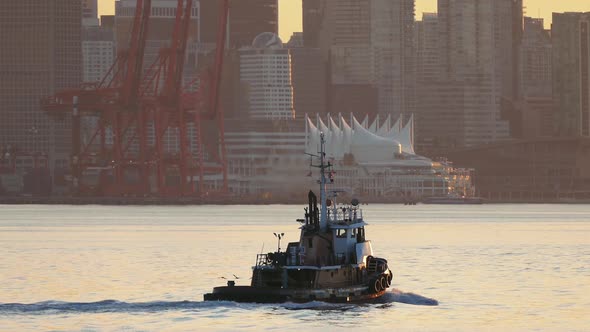 Vancouver Waterfront With Passing Boat