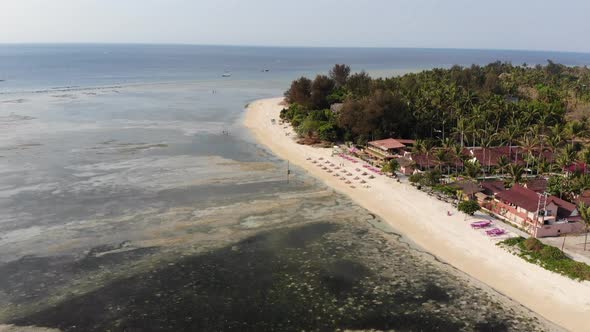 Drone shot of Gili Air island, Indonesia, on a hot, sunny day.