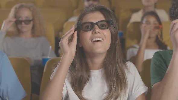 Beautiful Woman Putting on 3d Glasses in Cinema, Eating Popcorn and Laughing, Portrait of Caucasian