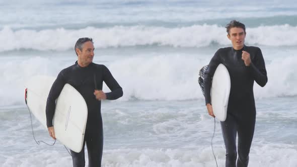 Father and young adult son enjoying outdoor activities together