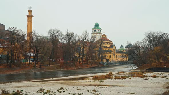 Left To Right Pan Real Time Establishing Shot of a Building on the Banks of the Isar River in Munich