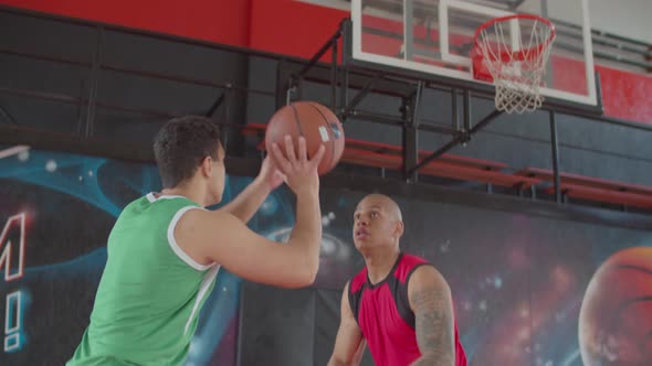 African Basketball Player Blocking Shot of Opponent