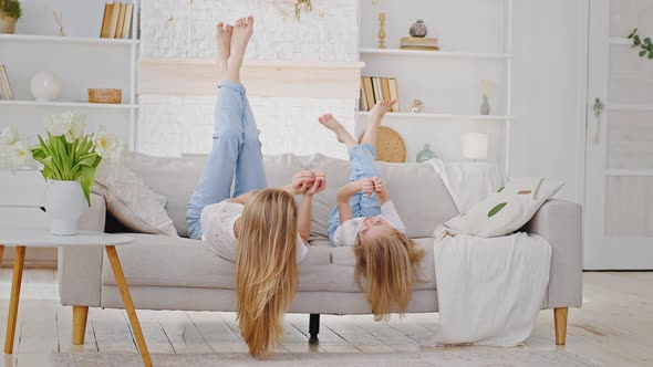 Caucasian Family Lonely Mother with Long Hair and Little Girl Daughter Child Wear Casual Clothes