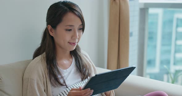 Woman look at the tablet computer at home