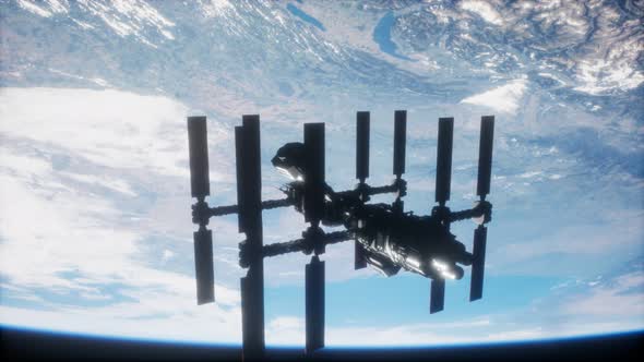 International Space Station in Outer Space Over the Planet Earth alt