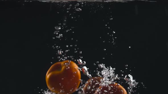 Three Fresh Tomatoes Falling in Water, Organic Food, Vegetarian Nutrition, Salad