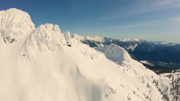 Flying Over Jagged Snowy Mountain Peaks North Cascades Range Reveal Huge Valley Baker Lake