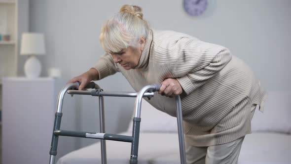 Elderly Woman With Walking Frame, Medical Equipment Using After Trauma, Hospital