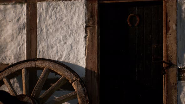 Old Wood Wheel and Black Door at White House