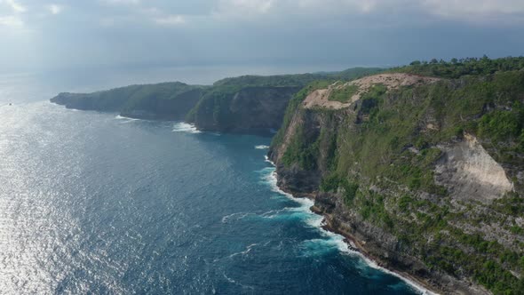 Aerial View at Blue Ocean and Nusa Penida Island at Sunset Time, Bali, Indonesia