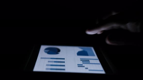 Man's Hand Working on Digital Tablet at Office Desk, Using Self Created Chart 