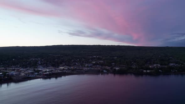 Drone aerial view of a colorful sunset of Grand Marais, MN in the fall