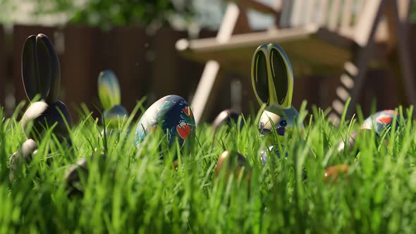 Easter egg hunt. Cute chocolate bunnies and eggs are hidden in green grass.