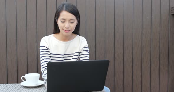 Woman working on laptop computer