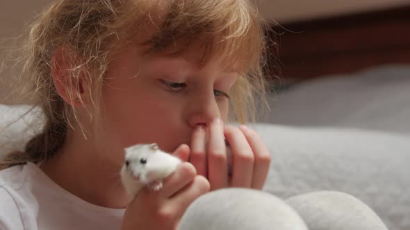 Little Girl Kissing Pet