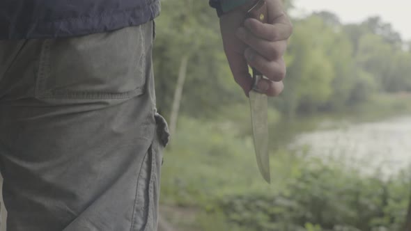 Maniac with a Knife in His Hand