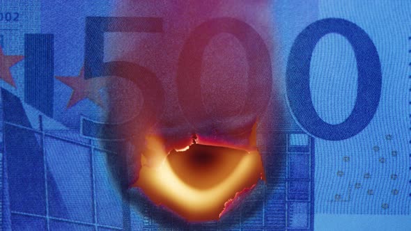 Burning of 500 Euro Banknote on Black Bacground Closeup