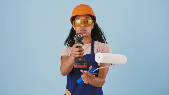 Darkskinned Lady in Hard Hat and Protective Goggles