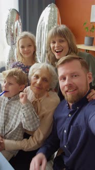 POV of Joyous Family Taking Selfie on Grandma Birthday