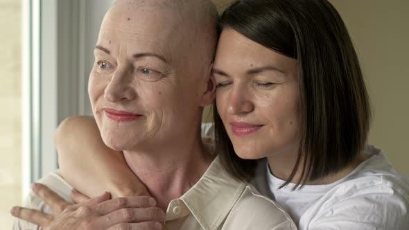 Young Woman Hugs Her Sick Mom After Chemotherapy