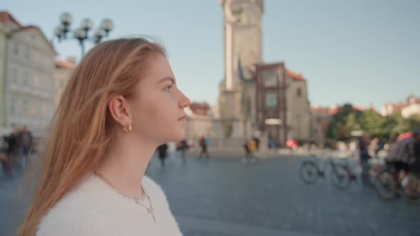 Young Woman Walking In Square In Prague